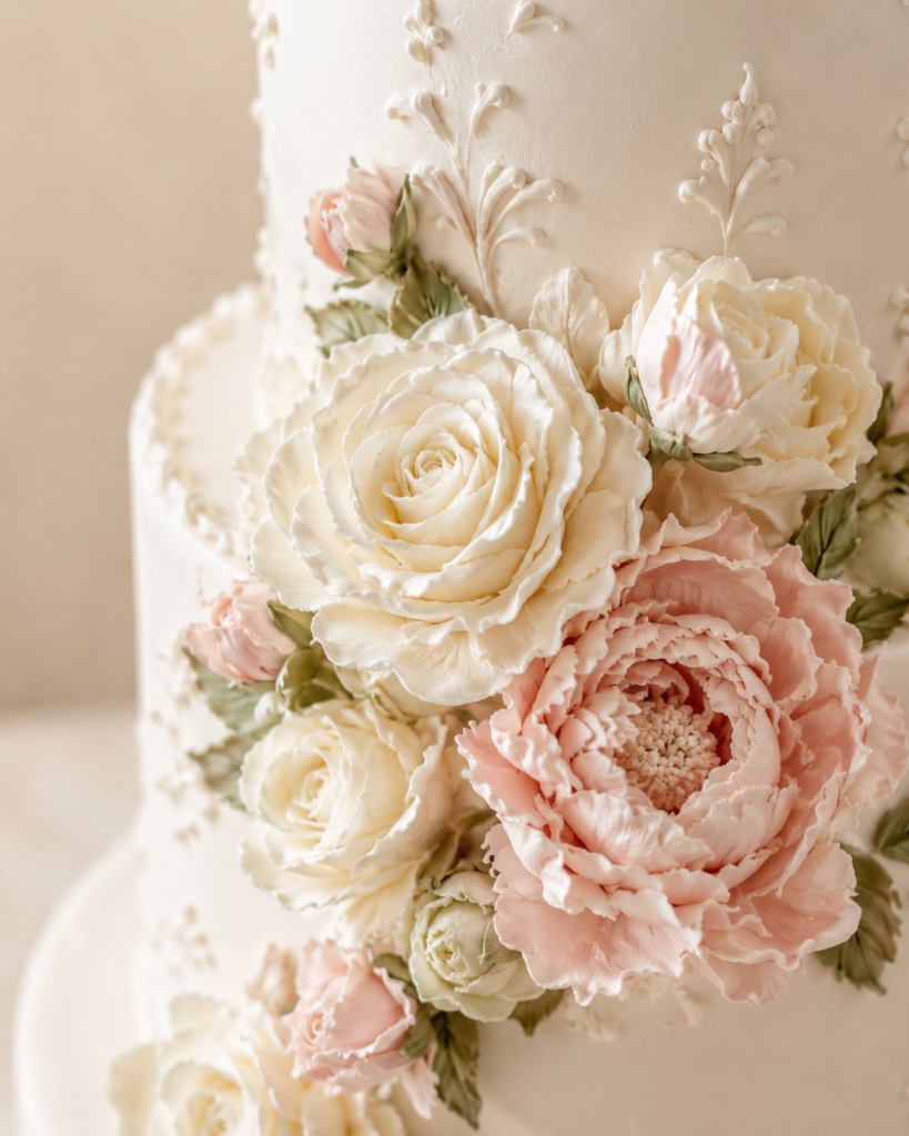 Handcrafted buttercream flowers decorating a luxury floral cake